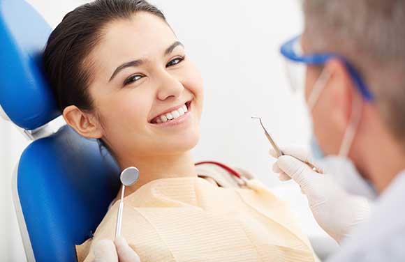 Woman smiling with white teeth from cosmetic dentistry in Seattle