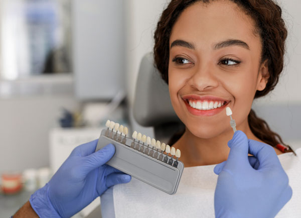 Woman getting professional teeth whitening in Seattle, WA